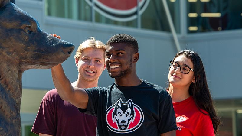 Students at Husky statue